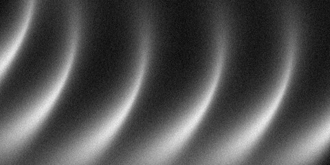 Abstract monochrome grainy gradient with dark tones, A noise texture with soft gradient light fading from dark to light, creating an abstract black and white visual effect.
