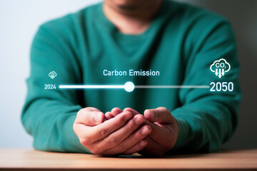 Businessman holding loading bar update of carbon reduction for green economy to reduce carbon...