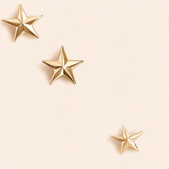 Obraz premium Three small golden stars on soft pastel background create whimsical and elegant atmosphere, perfect for adding touch of charm to any design