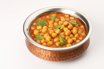Chole or Chick pea curry  served in a copper bowl