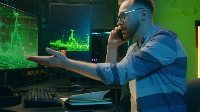 Angry Caucasian man male freelancer business crypto analyst talking mobile phone negotiations guy looking computer screen annoyed trader argue quarrel stress neon at home scam problem error night work