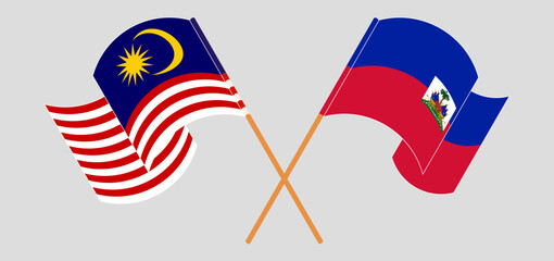 Crossed and waving flags of Malaysia and Republic of Haiti. Vector illustration