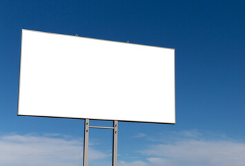 Big blank billboard on a roadside and blue sky