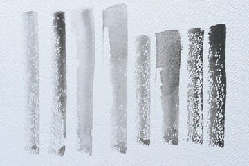 set of brush strokes on textured paper