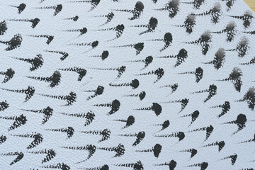 black strokes and daubs on textured paper