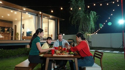 Family gather celebrate holiday. Parents, grandparents and girl together to talk and have dinner party food. Outdoor activity for spending time with multigeneration cross generation gap. Divergence.