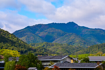 The view of Katsura River at autumn from Togetsukyo Bridge, Kyoto, Japan. A well-known place of scenic beauty in the western hills of Kyoto. Nature and travel concept.