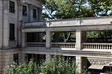 Historic Stone Courtyard and Balustrade with Blooming Flowers