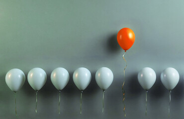 3d render illustration of a group of balloons with a single orange balloon in the center. Concept of uniqueness leadership