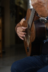 Spanish musician playing tratition original flamenco music on the guitar.