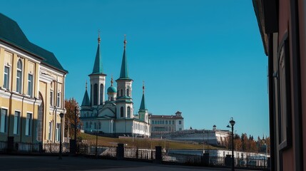 Fototapeta premium The colorful Kazan Kremlin with its iconic Mosque against a backdrop of clear blue skies.
