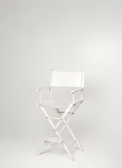 white director's chair in minimalist studio on white background