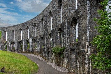 Fototapeta premium Inside of the granite McCaig’s Tower and Battery Hill on top of a hill overlooking the of Oban, Scotland, UK and Oban bay