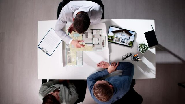 Real Estate Consultant Showing Apartment Blueprint