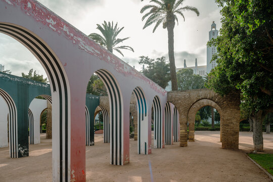 Casablanca, Morocco, 08 11 2024 :  parc de la ligue arabe. English : The Arab League Park. Arches of Daniel Buren. Cathedral in the background.