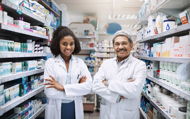 Portrait, pharmacy and mature man with woman in team with mentor, intern and arms crossed in drug...