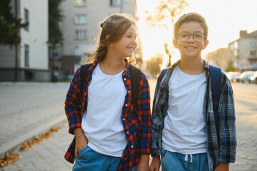 Portrait of smiling school kids standing at school yard