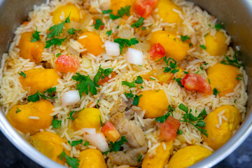 Traditional Brazilian dish rice, chicken and pequi (caryocar brasileinse) known as galinhada goiana