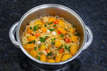 Traditional Brazilian dish rice, chicken and pequi (caryocar brasileinse) known as galinhada goiana