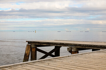 Fototapeta premium Small wooden pier at the Baltic Sea beach in the city of Sopot, Poland