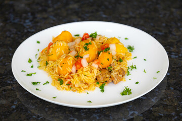 Traditional Brazilian dish rice, chicken and pequi (caryocar brasileinse) known as galinhada goiana