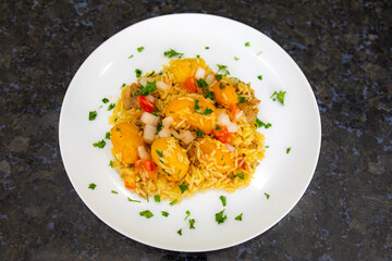 Traditional Brazilian dish rice, chicken and pequi (caryocar brasileinse) known as galinhada goiana
