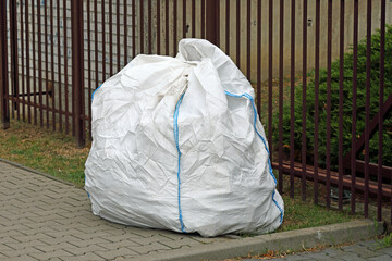 White, big bag with after renovation garbage
