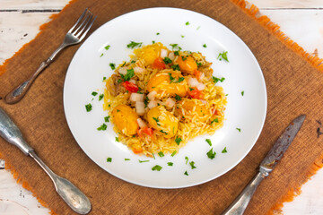 Traditional Brazilian dish rice, chicken and pequi (caryocar brasileinse) known as galinhada goiana
