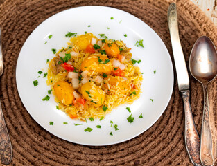Traditional Brazilian dish rice, chicken and pequi (caryocar brasileinse) known as galinhada goiana