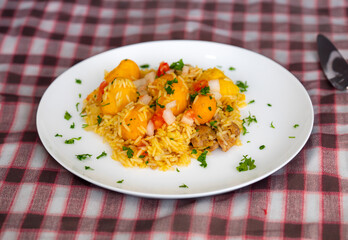 Traditional Brazilian dish rice, chicken and pequi (caryocar brasileinse) known as galinhada goiana
