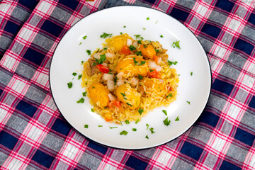 Traditional Brazilian dish rice, chicken and pequi (caryocar brasileinse) known as galinhada goiana