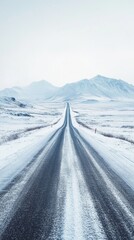 Winding Through Winter&rsquo;s Beauty: A Serene Scene of a Snow-Covered Road and Mountains
