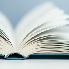 Fototapeta premium An open book with pages fanned out, showcasing its content and design.