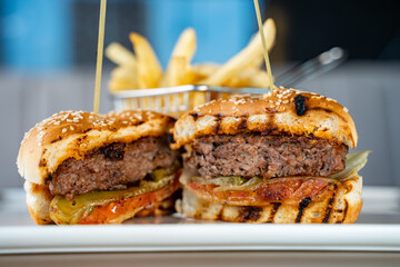 Close up of beef hamburger on restaurant table.