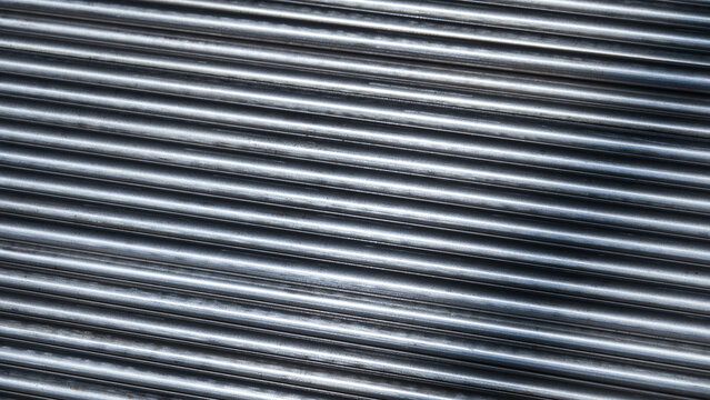 Steel rods arranged in parallel lines for construction in an industrial setting