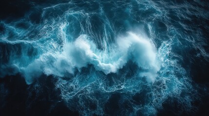 Aerial view of powerful ocean waves crashing, showcasing nature's dynamic energy.
