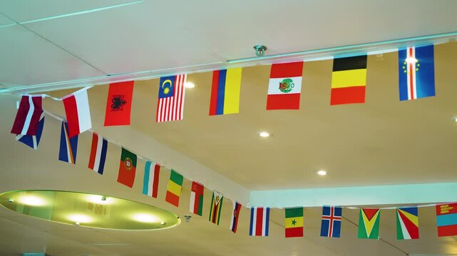 Vibrant Display of International Flags Aboard Ferry Journeying From Dunkirk or Calais to Dover Across English Channel. Political, international trade, relationship concepts