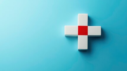 Obraz premium A white plus sign with a red square in the center, against a light blue background.