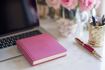 Elegant Workspace with Laptop, Notebook, and Pens 