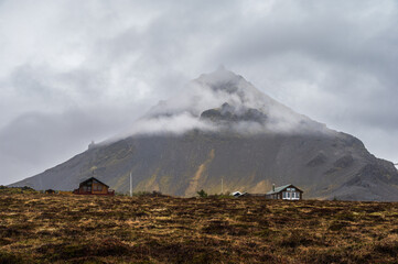 views of the cliffs surrounding the village of Arnarstapi during a rainy day on the Snaefellnes...