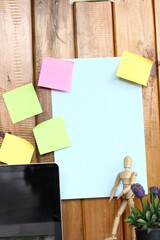 At office, collaborating on creative project, using sticky notes