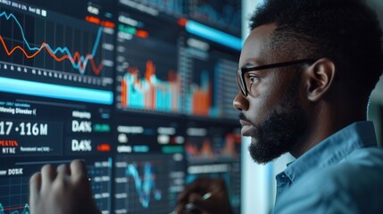 Fototapeta premium Businessman Analyzing Financial Data on Screen