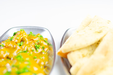 A plate of food with a side of bread