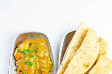 A plate of food with a side of bread