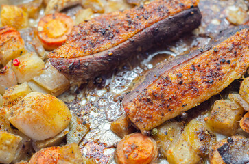 A plate of food with meat and vegetables on it