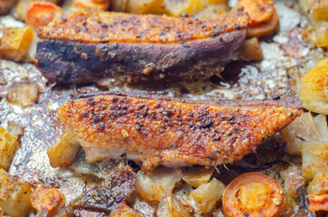 A plate of food with meat and vegetables on it