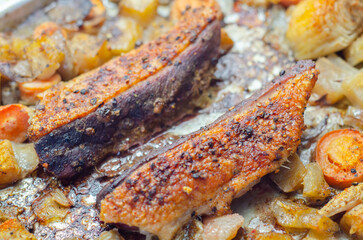 A plate of food with meat and vegetables on it