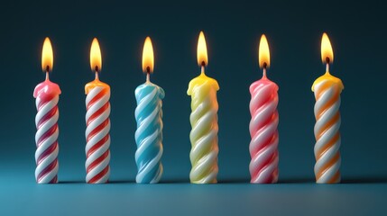 Six colorful striped candles lit against a dark teal background, creating a warm and festive atmosphere.