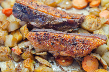 A plate of food with meat and vegetables on it