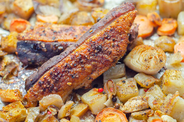 A plate of food with meat and vegetables on it